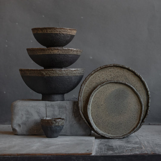 ceramic dinnerware set for 2 people in dark green and black with rough texture