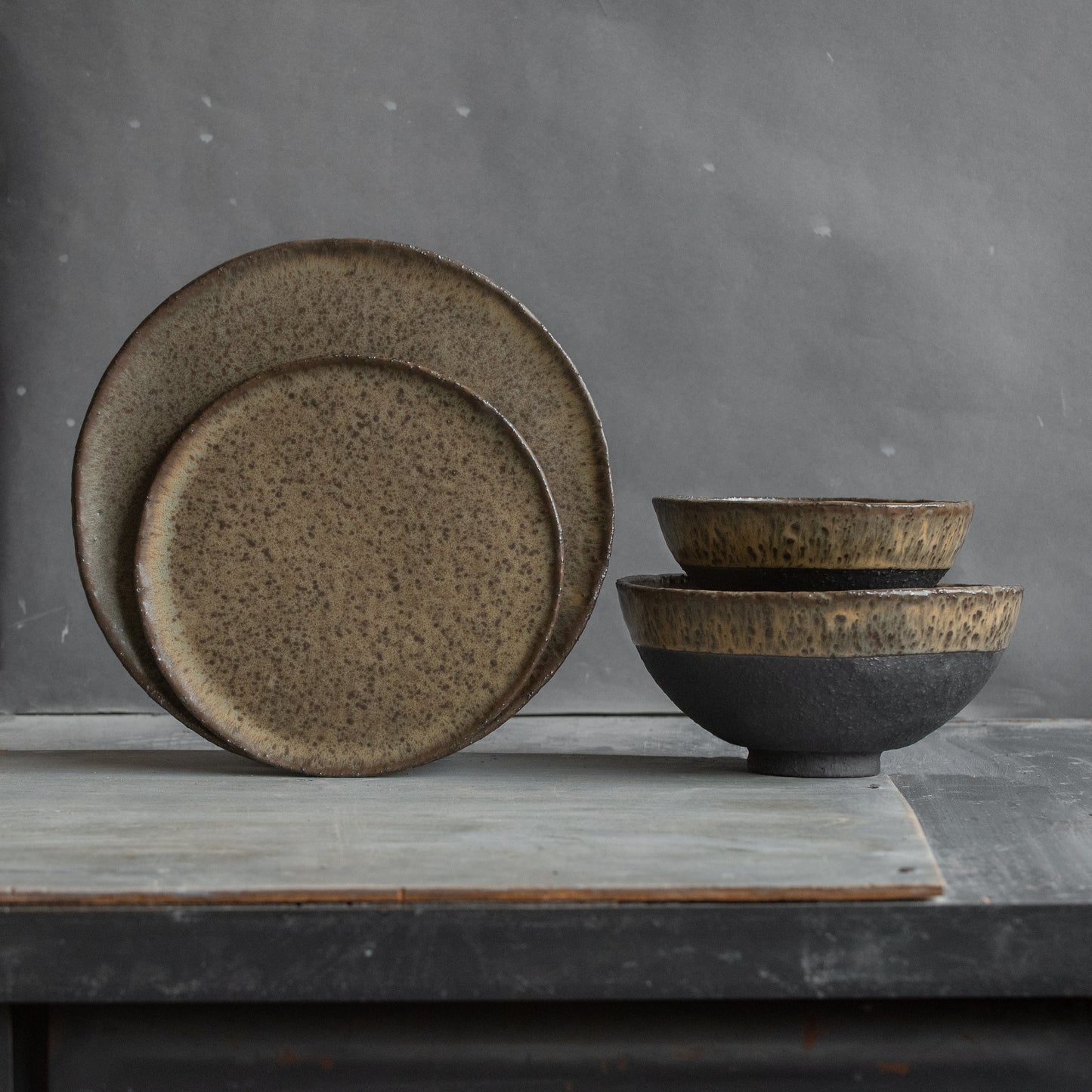 to ORDER a DINNERWARE SET for 1, 2, 4, 6, 8, 10, or 12 people ceramic bowls, flat plates in dark greenish black in minimal design, stoneware